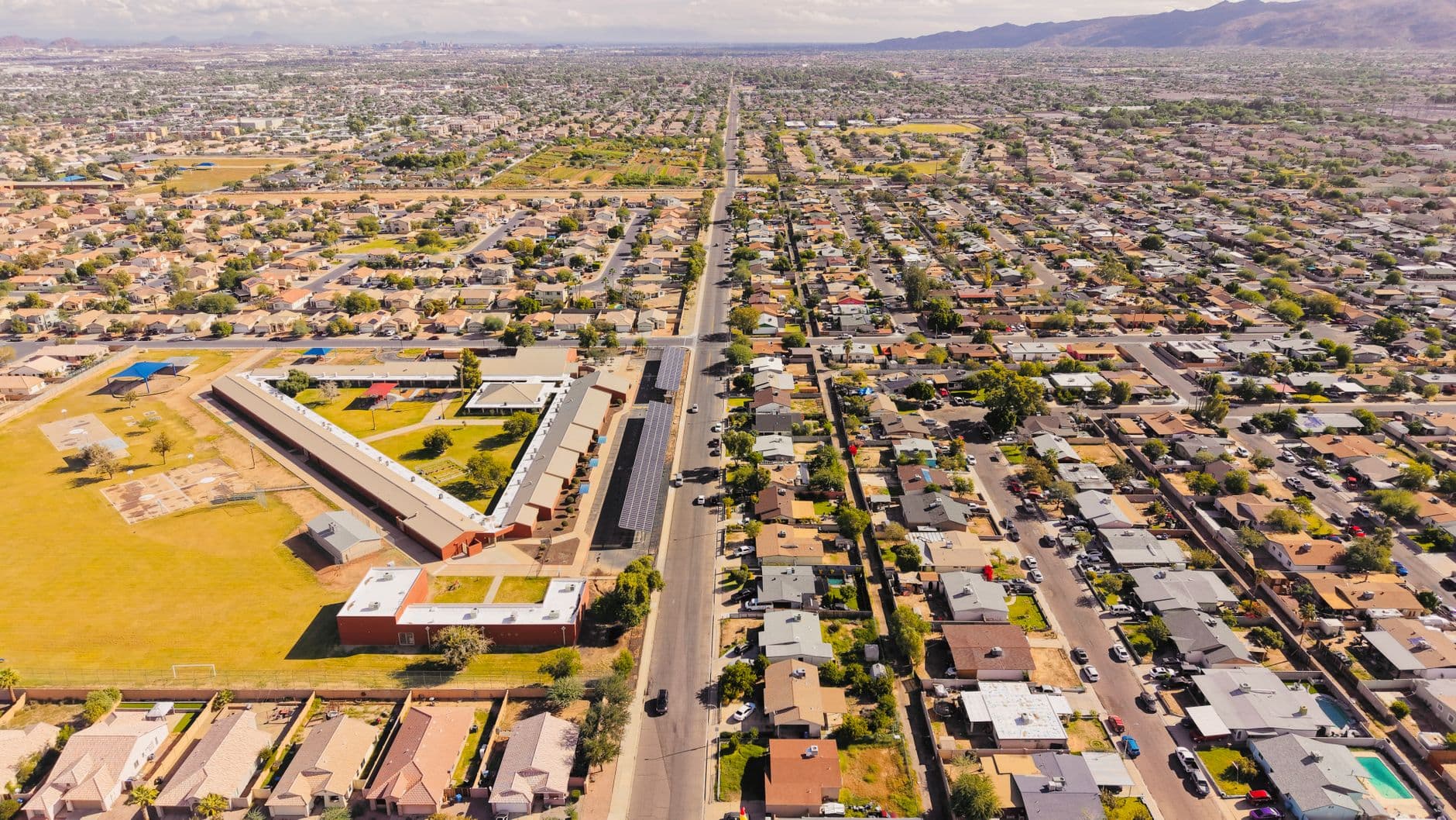 Aerial view of a sprawling residential area in Arizona under a bright day sky.